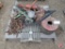 Assorted tractor parts: hydraulic cylinders, lights, wheel hubs, Ford tractor grill, tire chains