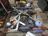 Tire iron, oil filter wrenches, tape measures, saw, crimping tool