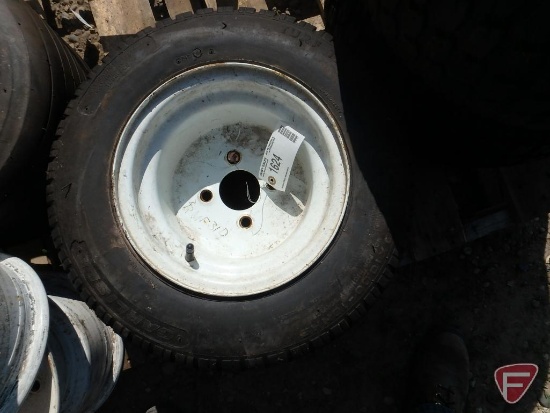 (1) 20x10x10 NHS Carlisle Turf Trac R/S tire and rim with 4-bolt, 4" pattern