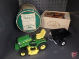 Replica John Deere X595 lawn tractor with wagon, John Deere tin, and John Deere wood puzzle in box