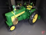 Ertl replica John Deere 630 tractor with blade and commemorative medallion