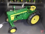 Replica John Deere 720 diesel tractor with commemorative medallion