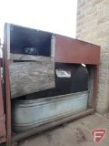 Waste oil barrel in galvanized containment tub with wood enclosure