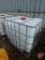 250 gallon chemical tank with metal pallet cage