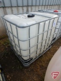 250 gallon chemical tank with metal pallet cage