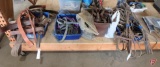 Horse tack: bridals, reins and bits, nylon halters, non matching stirrups, whip