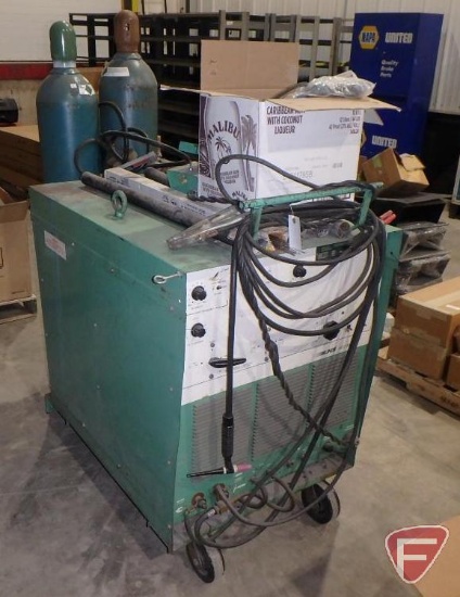 Linde UCC305 combination tig and stick welder with (2) tanks, leads, asst. wire rods, foot pedal