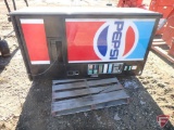 Vendo pop machine with Pepsi advertising