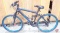 Genesis V2100 bicycle and turquoise Roadmaster Granite Peaks bike