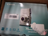 Canon Power Shot SD450 digital camera, Sportline pedometer, and Sportline sport flip pack