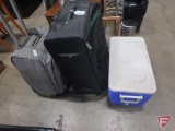 Coleman cooler, (2) suitcases, homemade tie-dye dresses, tablecloths, religious CD and DVD