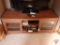 2-door media cabinet with Sony DVD player with DVDs and VHS cassette tapes