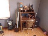 Roll top desk, 2-door filing cabinet, Sony 31 day pendulum clock, bottles, wood turning lamp