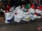 Large assortment of christmas decorations, all on bottom shelf