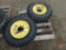 (2) Skid loader tires on 8-bolt rims: