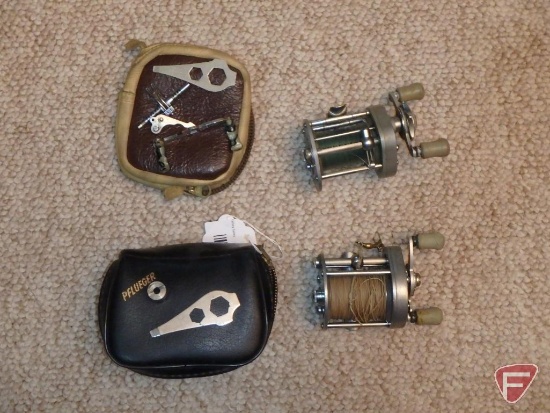 (2) Pflueger Supreme baitcasting reels with cases, adjustment wrenches, spare parts
