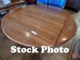 Wood round drop-leaf-to-square table on metal base, 50