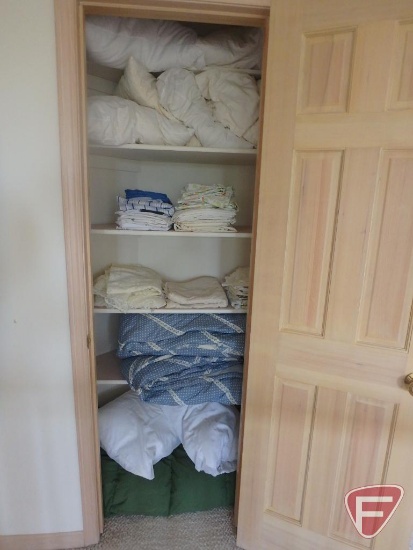 Contents of closet; feather pillows, linens, table cloths, comforters