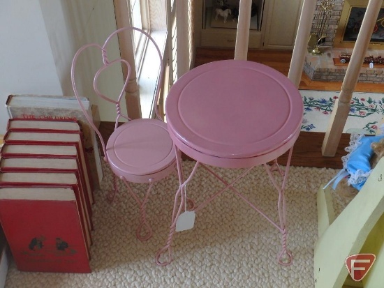 Doll cradle, table and chair, children's books