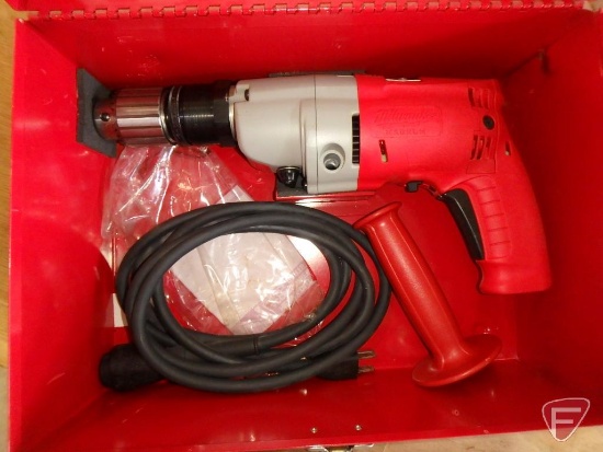 Milwaukee Magnum hammer drill with bits and metal case