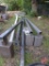 Metal outdoor light poles: (2) 14' w/lights, (2) 20' poles, (1) 16' pole, anchor bolts