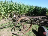 IH side dump rake on steel wheels, hitch is bent