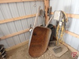 Metal wheelbarrow, post hole digger, halogen work light on stand, extension cord, shovel