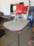 Table with chrome design and (2) matching chairs