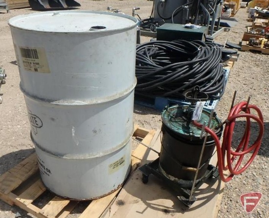 Lubriplate food grade lubricant in 55 gallon drum approx. half full, oil pump on 5 gallon bucket