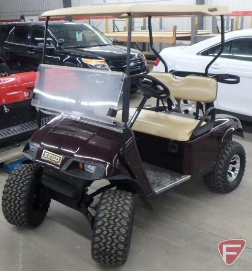 2002 EZ-GO TXT electric burgundy golf car, lift kit, lights, rims, top, windshield, 99 min.