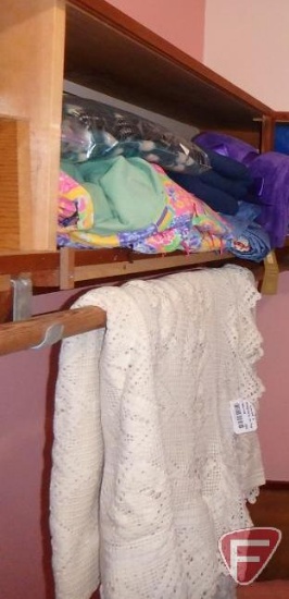 Blankets, coverlet/bedspread on top shelves