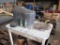 Enamel table, copper still, sliding door hardware, wood crates, stove door, vintage glass bottles