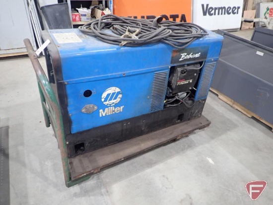 Miller Bobcat 225NT 8000w generator/welder, 2986 hours showing, on 4 wheel cart 27"x48"