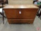 Vintage wood storage chest with bottom drawer and (2) wool blankets and table linens,