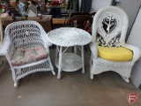 (2) white wicker rocking chairs and table; table has some damage