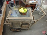 Wicker tea cart, imitation fruit, and glass pitcher
