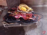 Assortment of extension cords, yard sticks, rope
