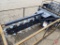 Unused Wolverine 6' trencher skid loader attachment