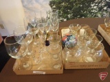 Mixed stem glasses, candles, glass pebbles