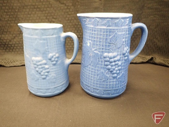 (2) blue pitchers with grape design, tallest is 9.25"h. 2pcs