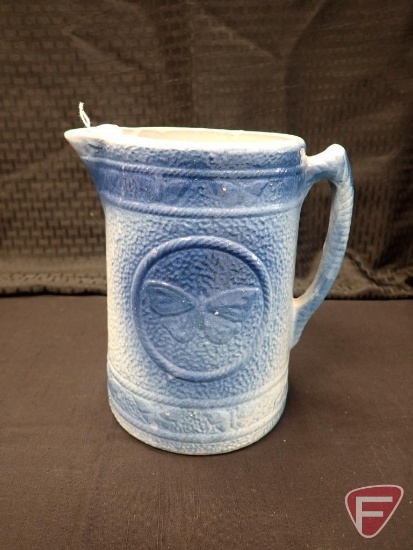 Blue/white pottery pitcher, butterfly design, 8"h