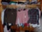 LADIES WESTERN SHIRTS AND SWEATERS. ALL HANGING IN CLOSET