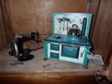 TOY STOVE AND SINGER SEWING MACHINE. 2 PCS