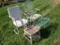 (2) Metal lawn chairs and 1 wood one, metal table