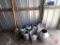 Watering cans, galvanized pail, shovel, broom, pitchfork, stainless container