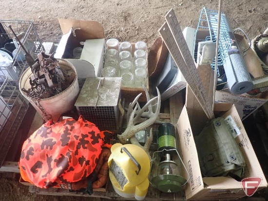 Canning jars, animal traps, minnow bucket, knife set, wall clock, antlers.