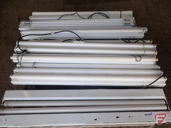 Fluorescent light fixtures and bulbs. Contents of pallet
