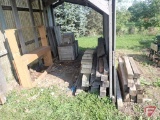 Contents of shed; lumber, bricks, wood crates, wood shelf, wood fence panels, plastic pallets