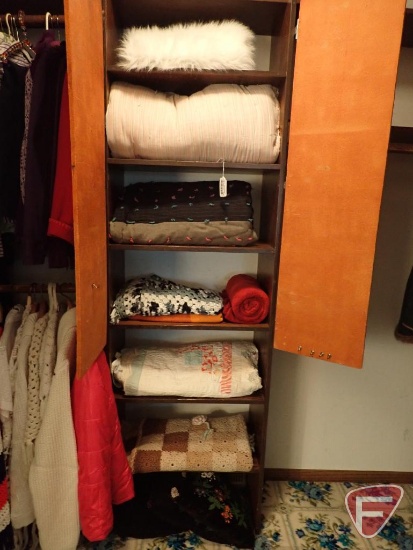 Quilts, afghans, throws, throw pillows. All in center cabinet.