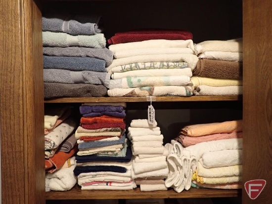 Towels, hand towels, wash cloths. Contents of top 2 shelves in closet